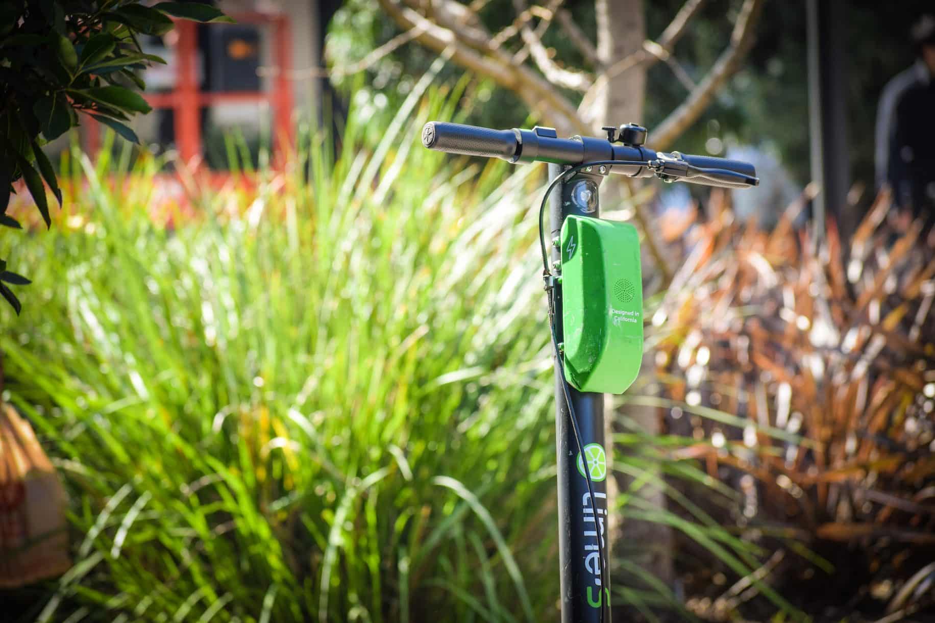 A Lime e-scooter awaits a user to unlock it in Downtown Long Beach. Photo by Brian Addison.