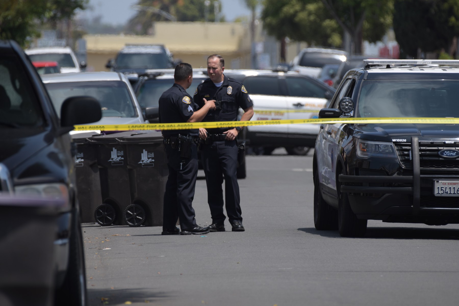 Police investigate a shooting near Poly High School. Photo by Thomas R. Cordova.
