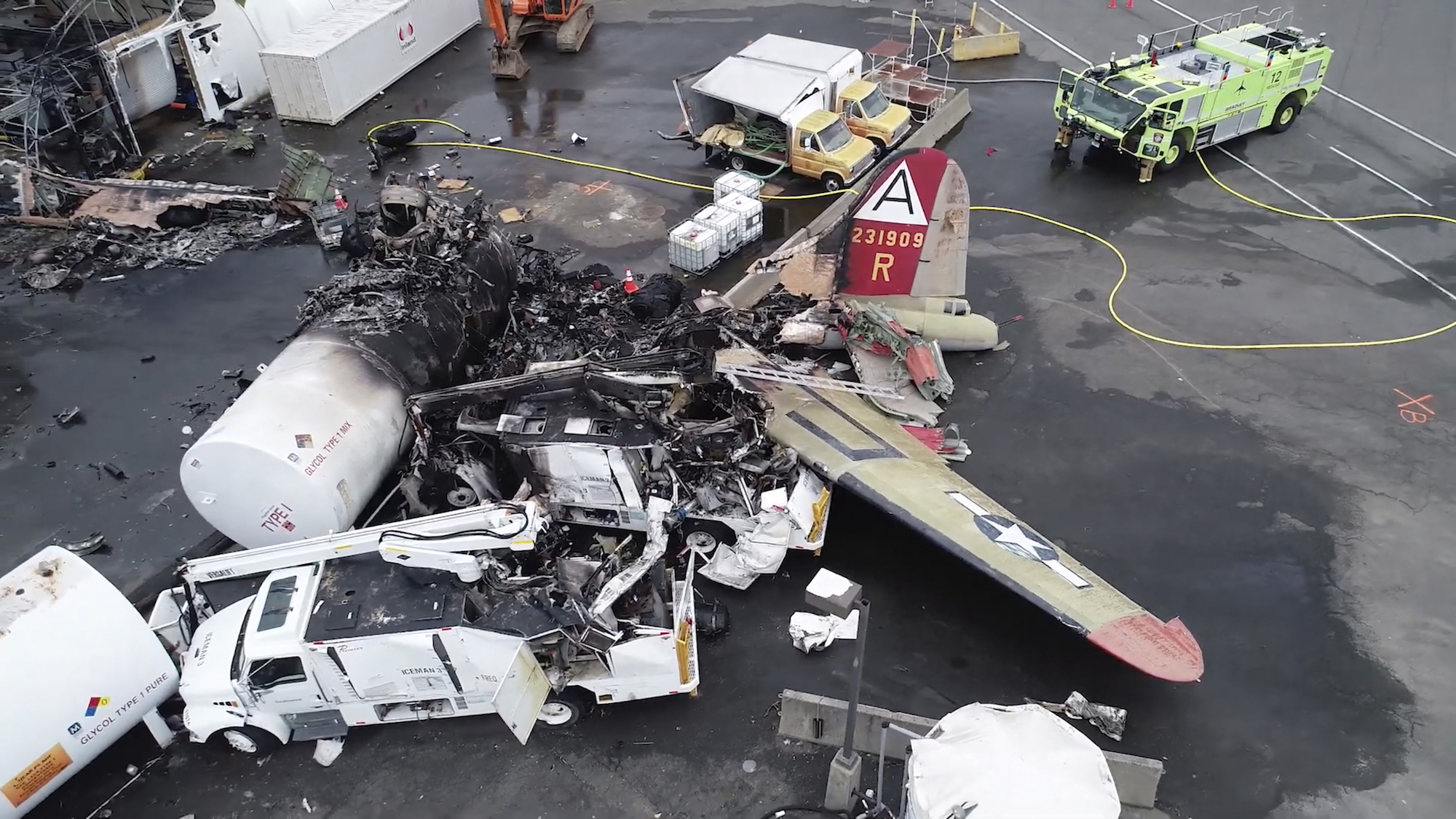This image taken from video provided by National Transportation Safety Board shows damage from a World War II-era B-17 bomber plane that crashed Wednesday at Bradley International Airport. Photo from NTSB via AP.