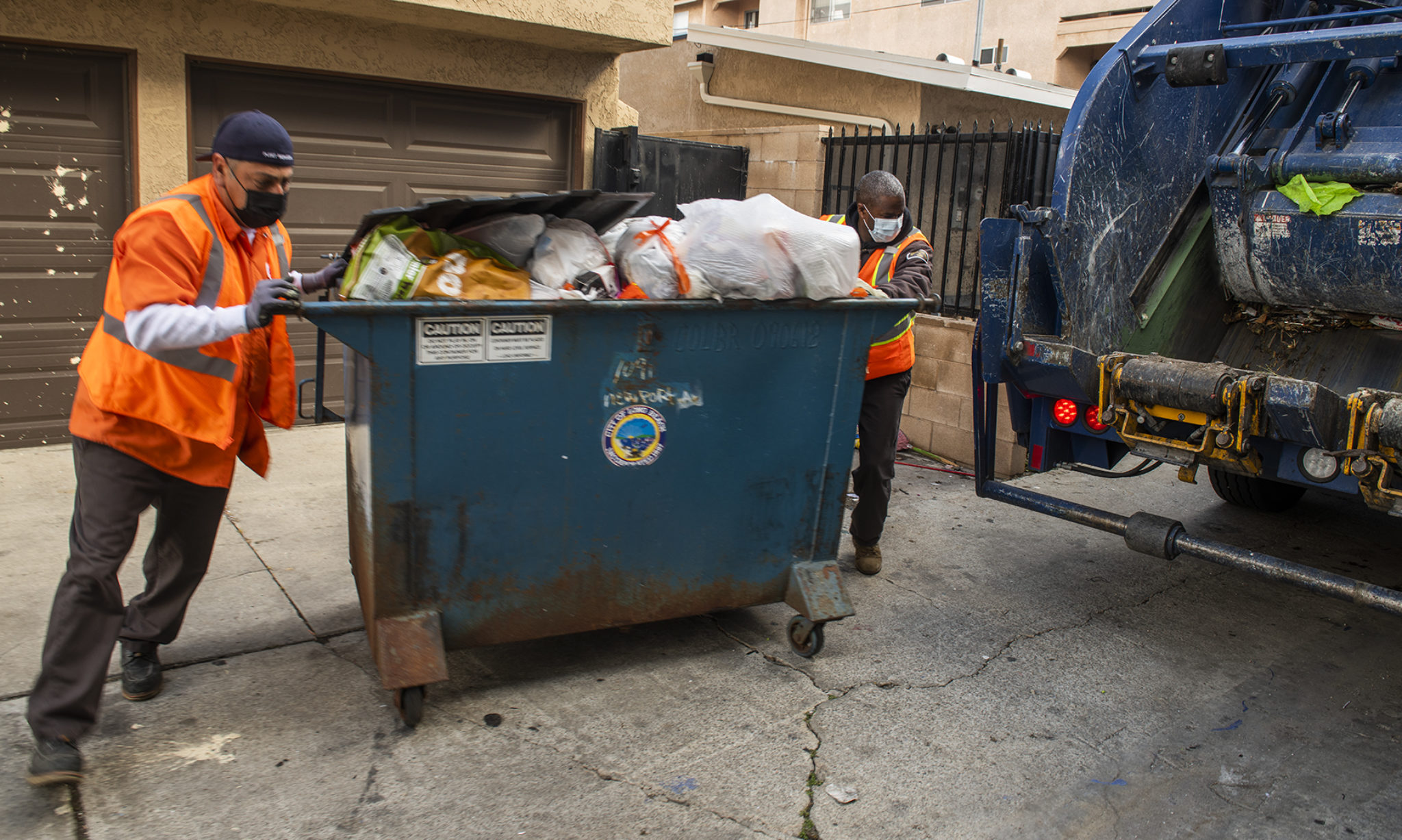 Buried in trash from the COVID19 pandemic, Long Beach refuse workers