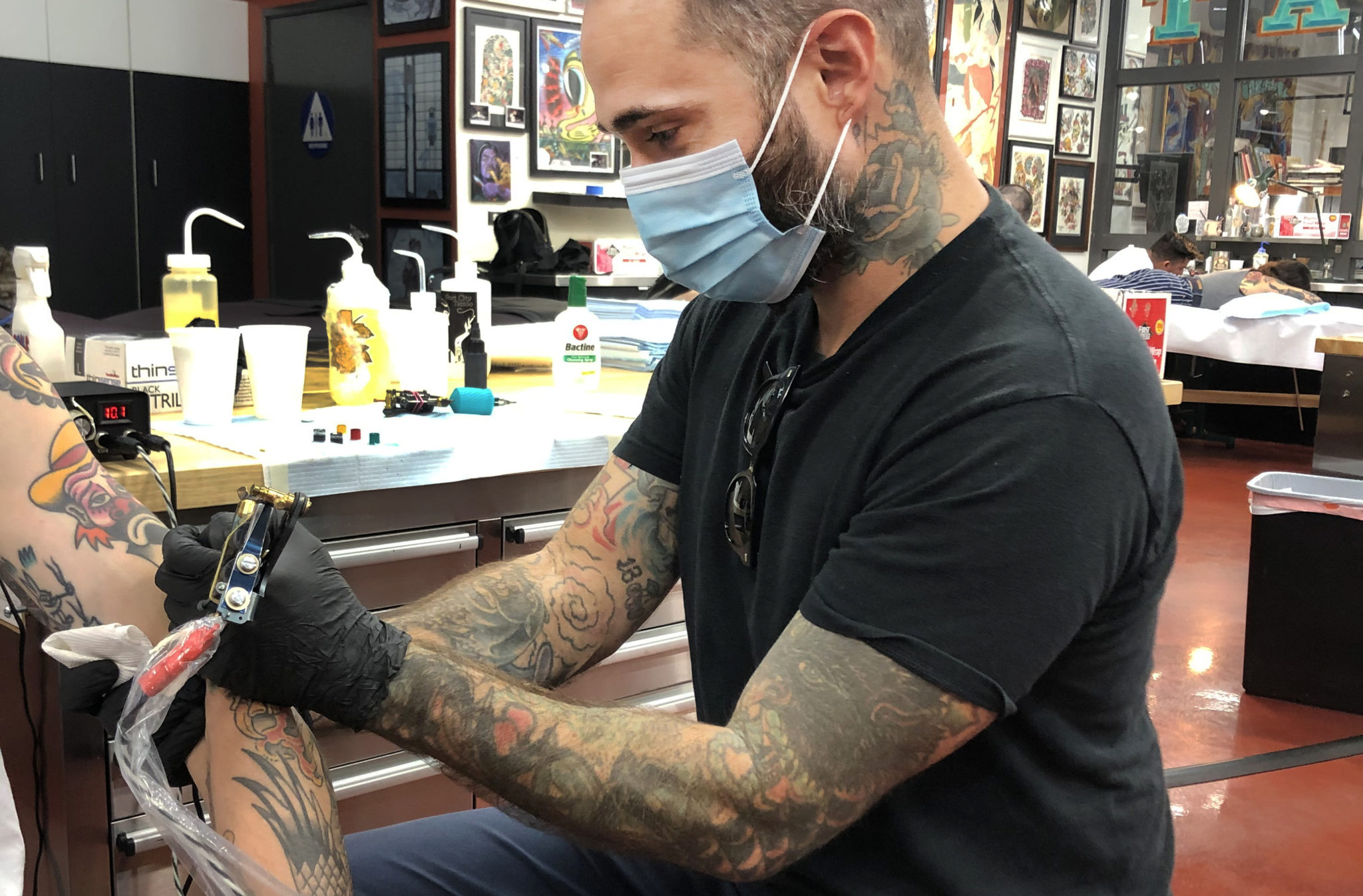 Tattoo shop owners sue governor, state health officials