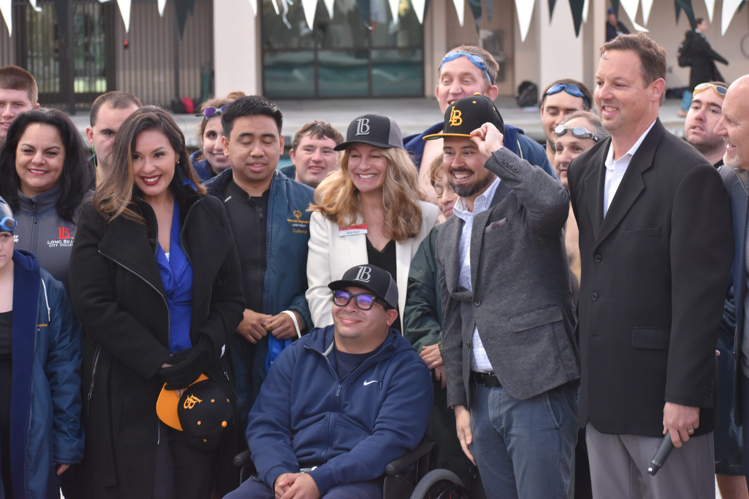 A group of people smile for the camera.