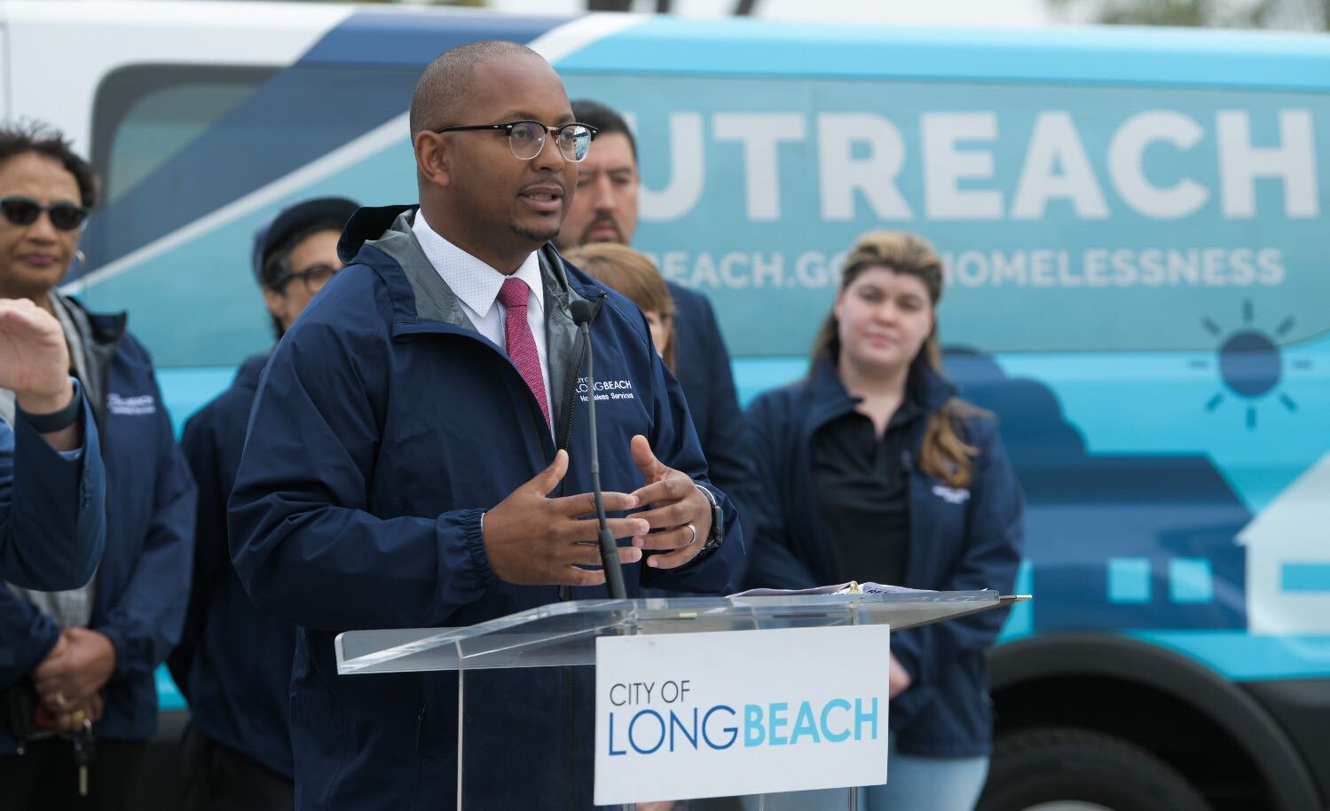 Mayor Rex Richardson speaks behind a lectern.