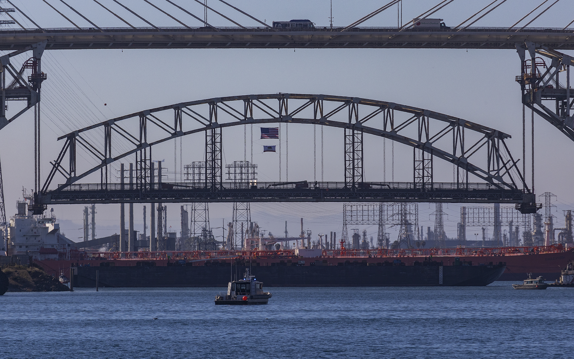 A large section of the Gerald Desmond Bridge is removed during demolition.
