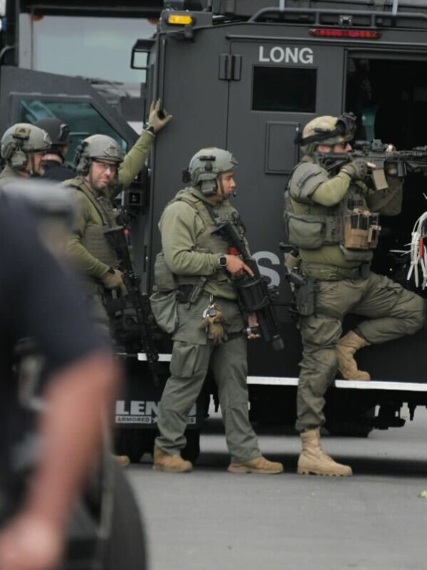 SWAT officers arrest man who barricaded himself in house after brandishing gun, LBPD says