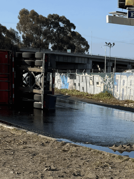 Tipped-over truck spills thousands of gallons of oil onto 710 Freeway in Long Beach