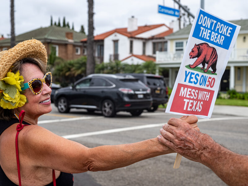 ‘Hold the Line’ protesters join hands in Long Beach, other coastal cities to support Prop. 50, oppose Trump