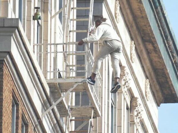 Assault suspect dangles from fire escape on 11th floor of Long Beach office building