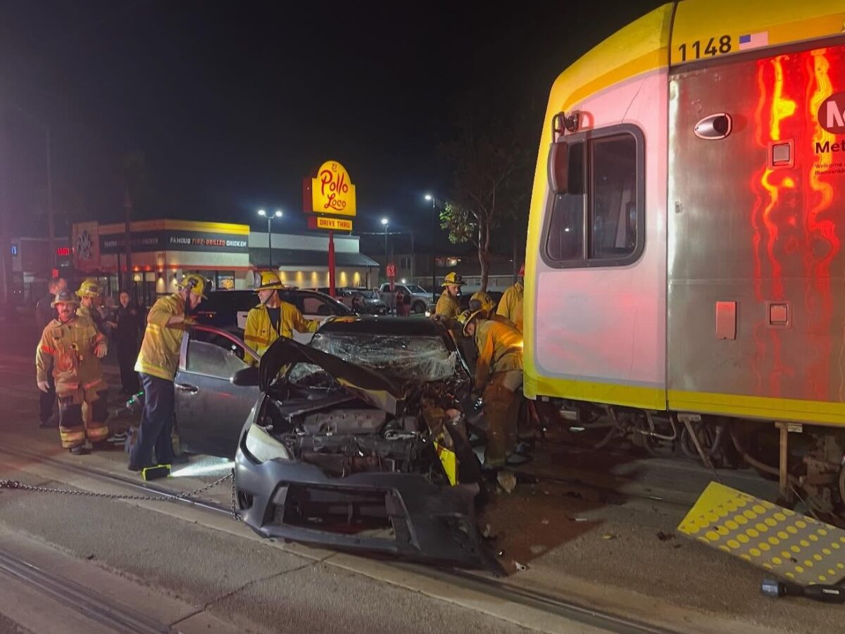 Firefighters rescue driver from car smashed by Metro train in Long Beach