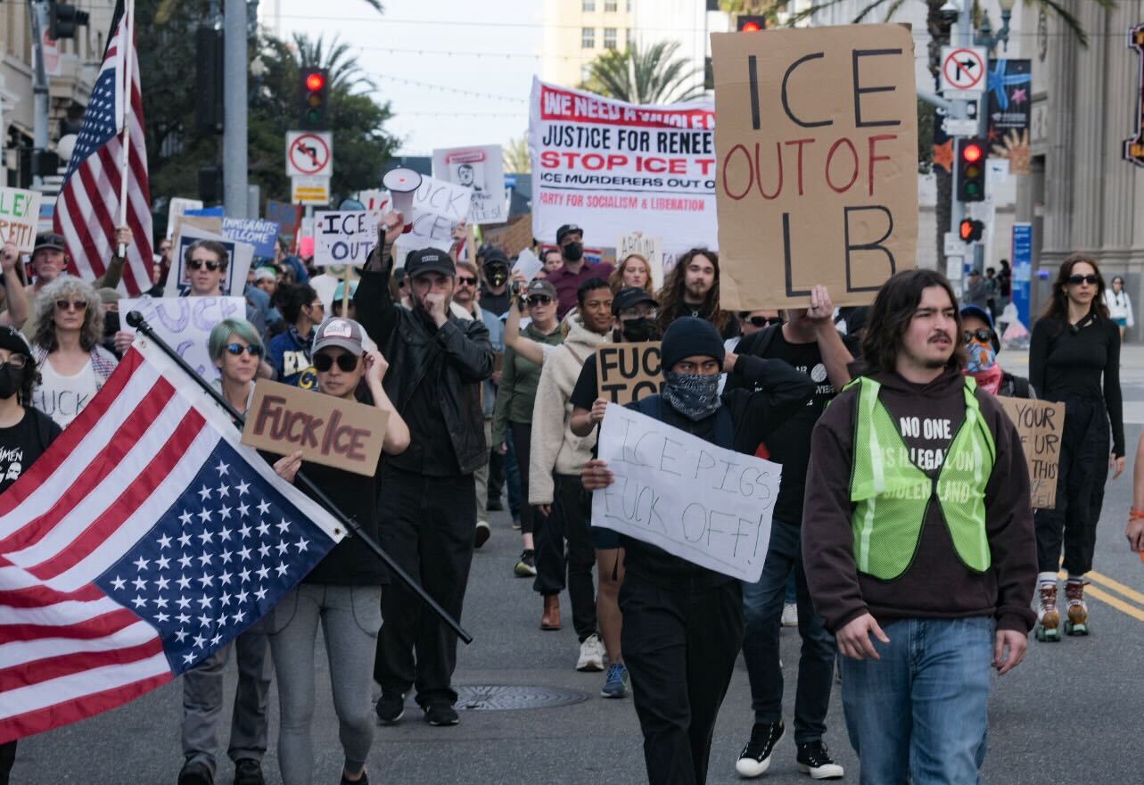 Anti - ICE protesters rally in Long Beach , condemn agent killing of man in Minneapolis