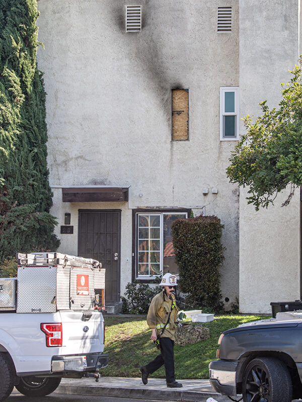 Bystanders save woman dangling from second-floor window to escape fire, LBFD says