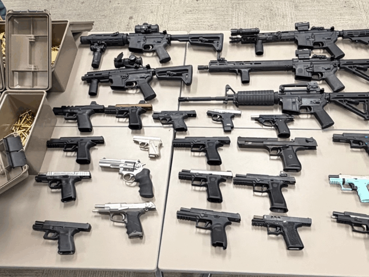 Dozens of guns seized from home of man wanted in road rage shooting, police say