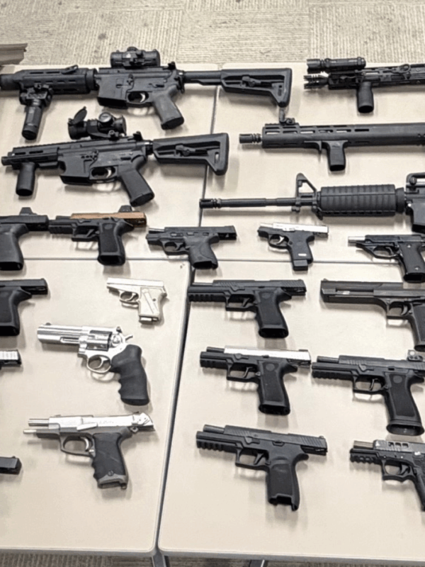 Dozens of guns seized from home of man wanted in road rage shooting, police say