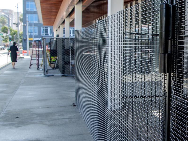 Long Beach built a fence around its library. A homelessness committee says it’s a waste.