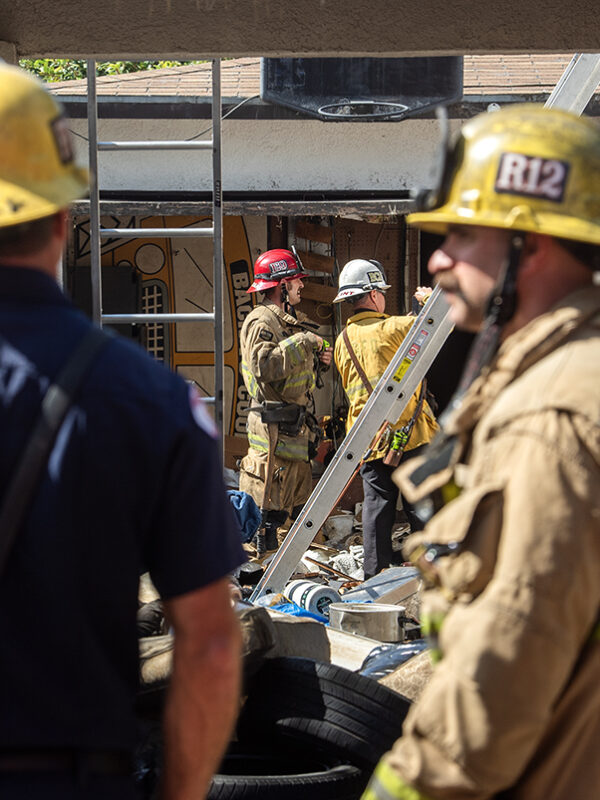 Firefighters knock down flames at unoccupied home filled with trash