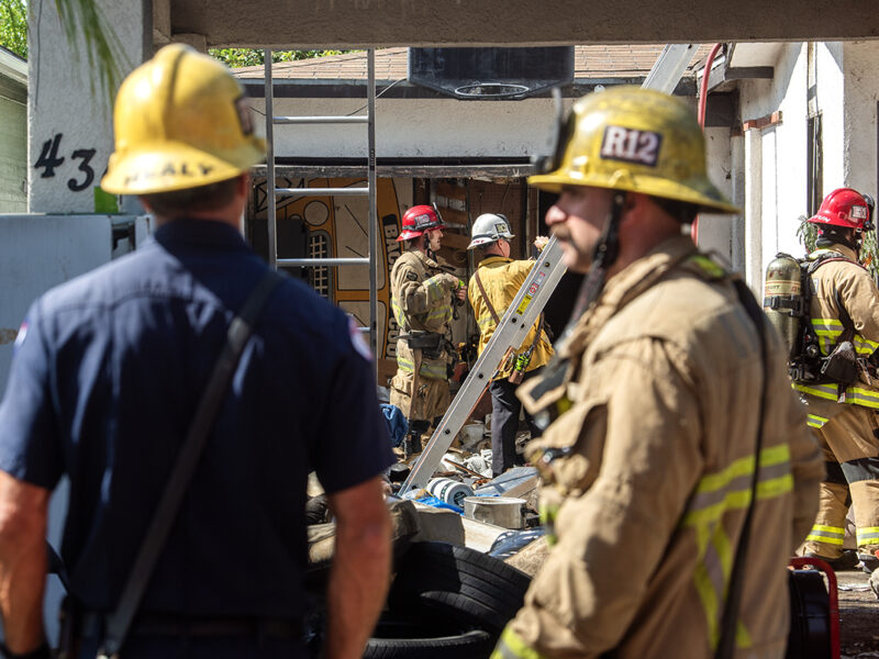 Firefighters knock down flames at unoccupied home filled with trash