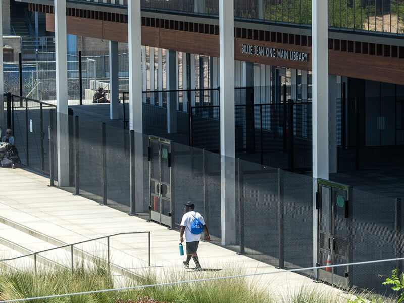 Long Beach says the fence around its library is working; a homelessness committee isn’t convinced
