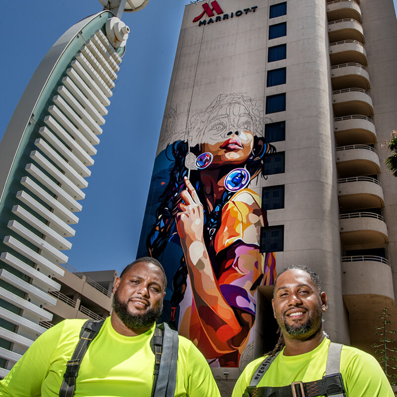 He’s painting a 12-story mural in the heart of downtown; here’s his message of encouragement
