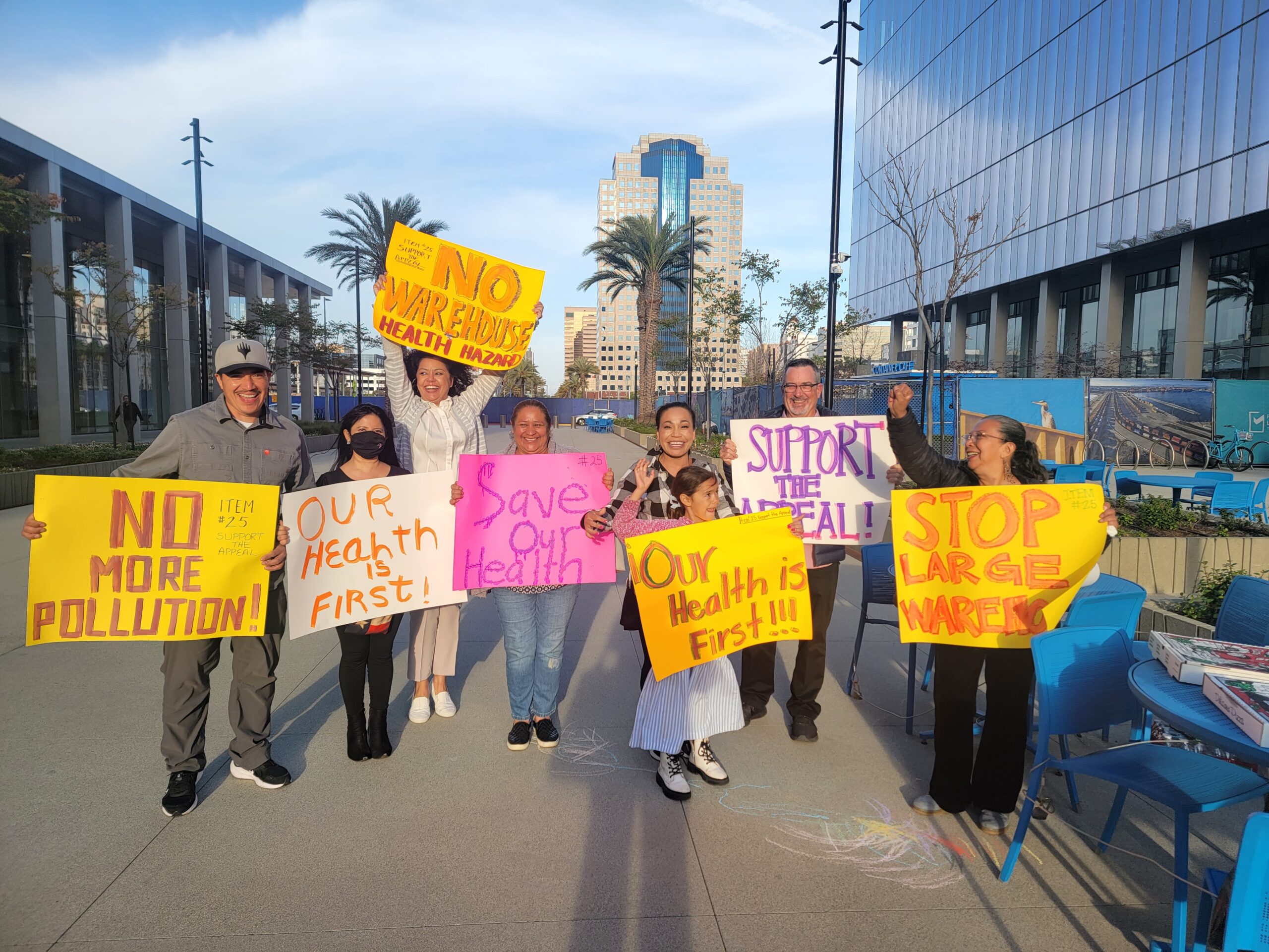 People hold posters with slogans like, "No more pollution" and "Our health is first."